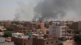 Smoke rises from a central neighborhood of Khartoum, Sudan, Sunday, April 16, 2023