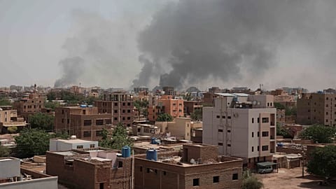 Smoke rises from a central neighborhood of Khartoum, Sudan, Sunday, April 16, 2023