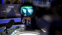 In this Sunday, April 13, 2015 photo, Arab newscaster Lucy Aharish, seen through a viewfinder, speaks during an interview