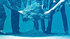 Businesspeople planting a tree