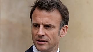 French President Emmanuel Macron looks on as he talks with Senegalese war veterans Friday, April 14, 2023 at the Elysee Palace in Paris.