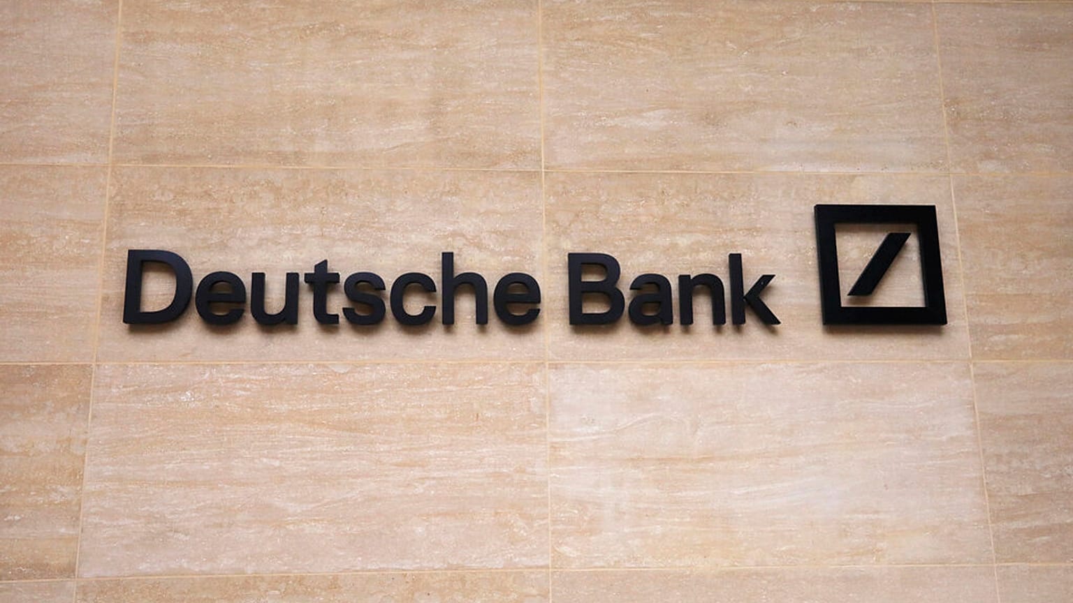  this July 8, 2019 file photo, a Deutsche Bank sign and logo are seen on the outside of their building in London. 