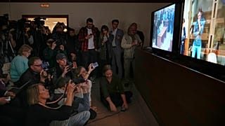 Journalists watch a TV screen broadcasting hearing on Wall Street Journal reporter Evan Gershkovich's case from a courtroom at the Moscow City Court, in Moscow, Russia.