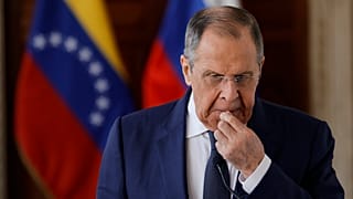 Сергей Лавров на фоне флагов Венесуэлы и России