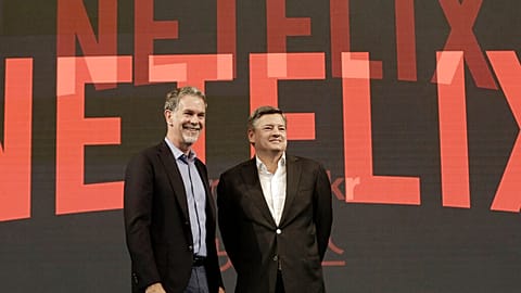 Reed Hastings, left, CEO of Netflix, poses with Ted Sarandos, Chief Content Officer of Netflix, during a press conference in Seoul, South Korea, Thursday, June 30, 2016.