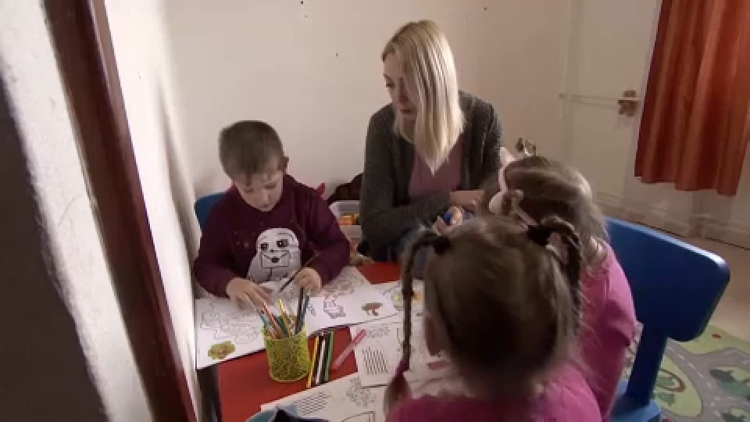 Young mother playing with children in an accomodation offered by Red Cross, Szeged, Hungary, April 18. 2023