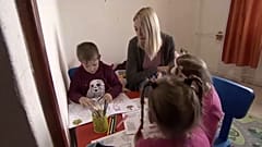 Young mother playing with children in an accomodation offered by Red Cross, Szeged, Hungary, April 18. 2023