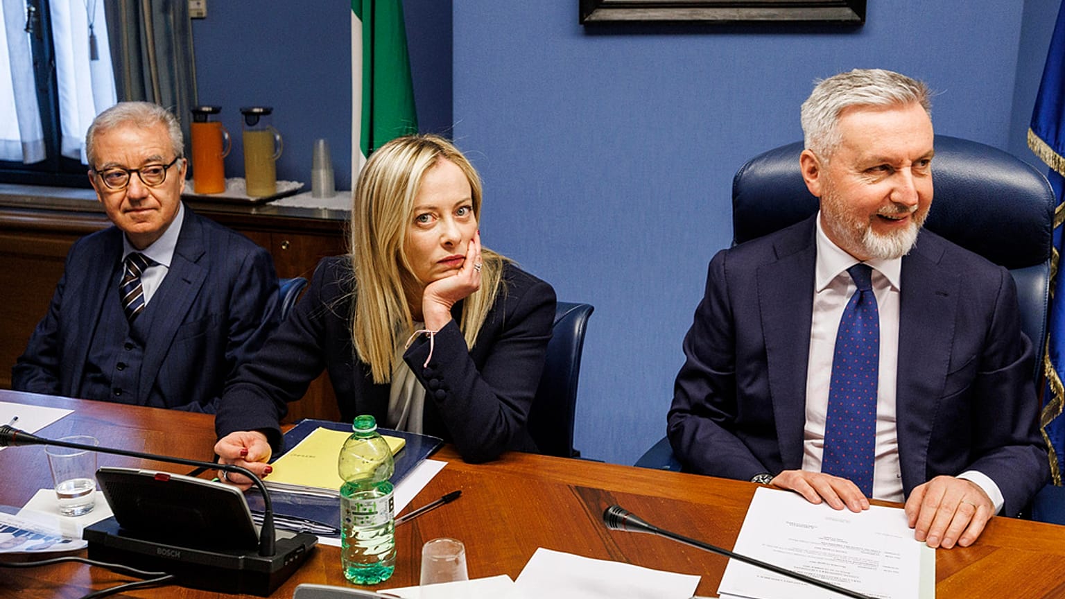 Italian Premier Giorgia Meloni, center, waits to start her briefing to COPASIR parliamentary intelligence commission in Rome.