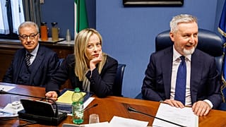 Italian Premier Giorgia Meloni, center, waits to start her briefing to COPASIR parliamentary intelligence commission in Rome.