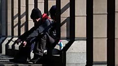 FILE: Homeless person in London, UK, March 2020