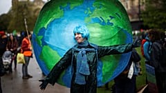A demonstrator wears a costume as people protest during the Extinction Rebellion's 'The Big One'