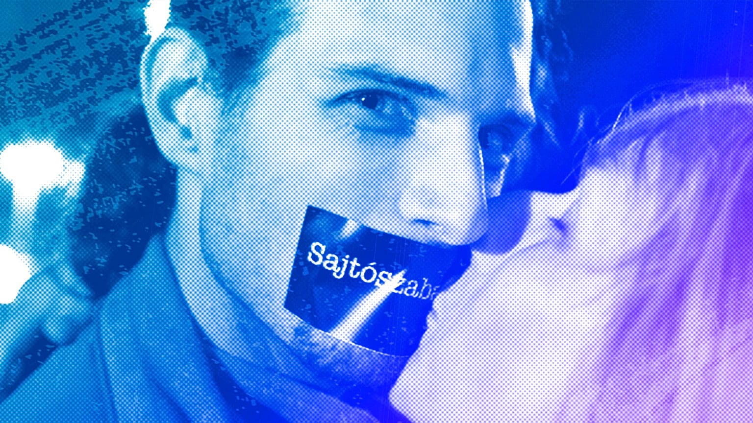 A woman kisses a Hungarian activist during a demonstration against the government's new media law in Budapest, January 2011