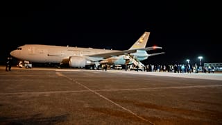 An Air Force plane carrying Italian citizens evacuated from Sudan lands at the Ciampino Military airport in Rome, Monday, April 24, 2023