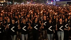 A torchlight procession marches during a demonstration in Yerevan, Armenia