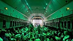 In this photo provided by the Spanish Defence Ministry citizens of different nationalities, fleeing from Sudan, sit inside a Spanish Air Force aircraft on its way to Madrid.