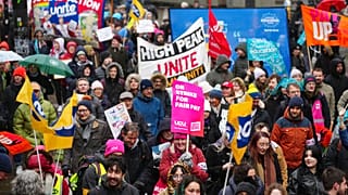 A demonstration in support of strikers is seen in central Manchester, England, Wednesday, Feb. 1, 2023.