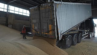 A truck unloads grain at a grain port in Izmail, Ukraine, Wednesday, April 26, 2023. 