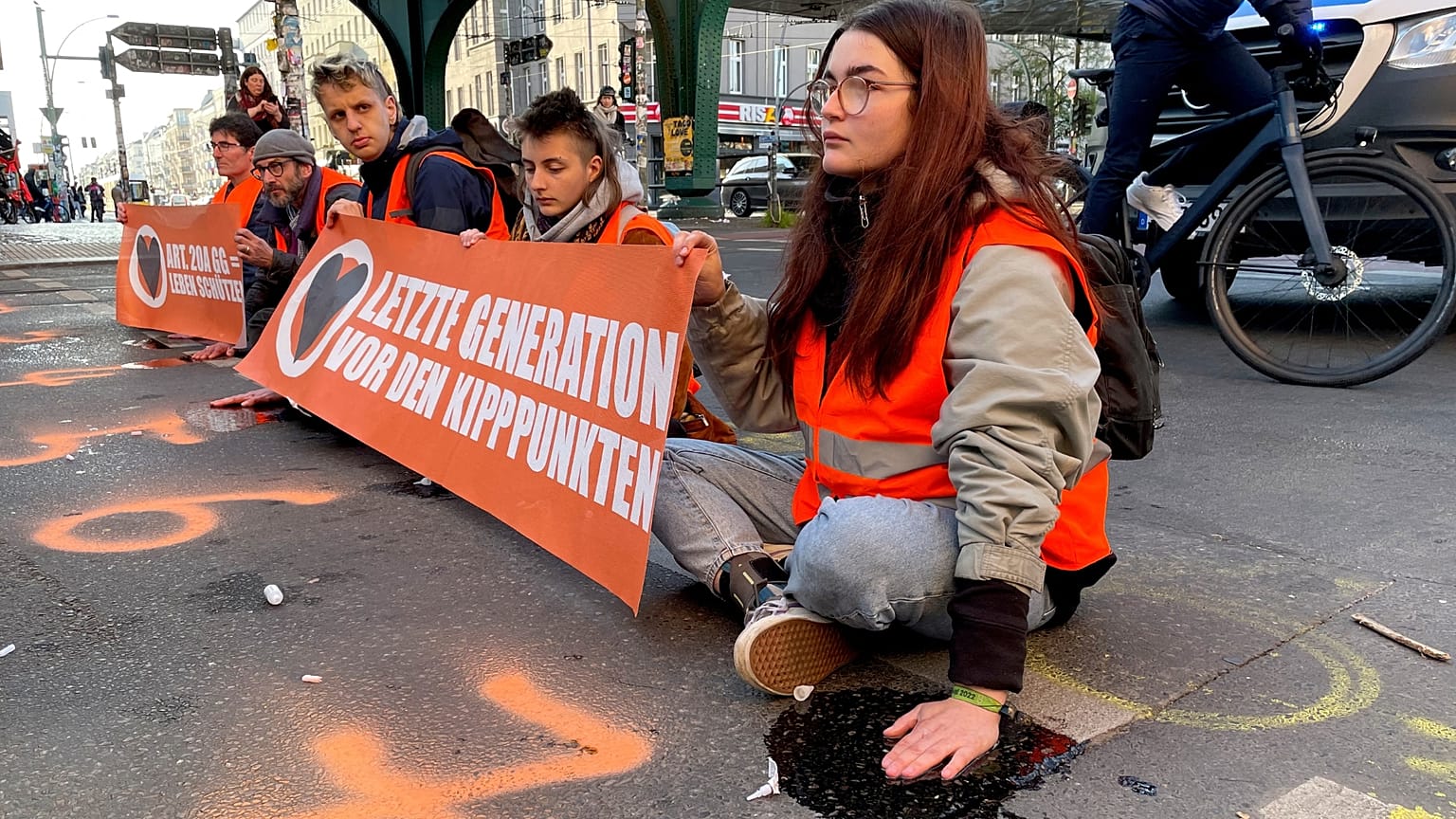 Last Generation activists block a road amid a protest in Berlin.