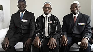 Ousmane Sagna, Oumar Dieme, and Guorgui M' Bodji, (left to right) African war veterans who fought for France, near Paris in 2016.