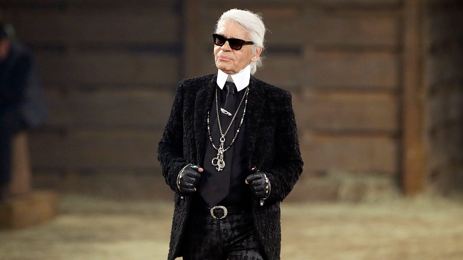 Met Gala subject Karl Lagerfeld takes a bow at the end of his Metiers d'Art fashion show in Dallas in 2013