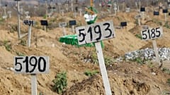 Nov. 16, 2022 image from video shows some of the new graves which have been dug since the Russian siege of Mariupol began. 