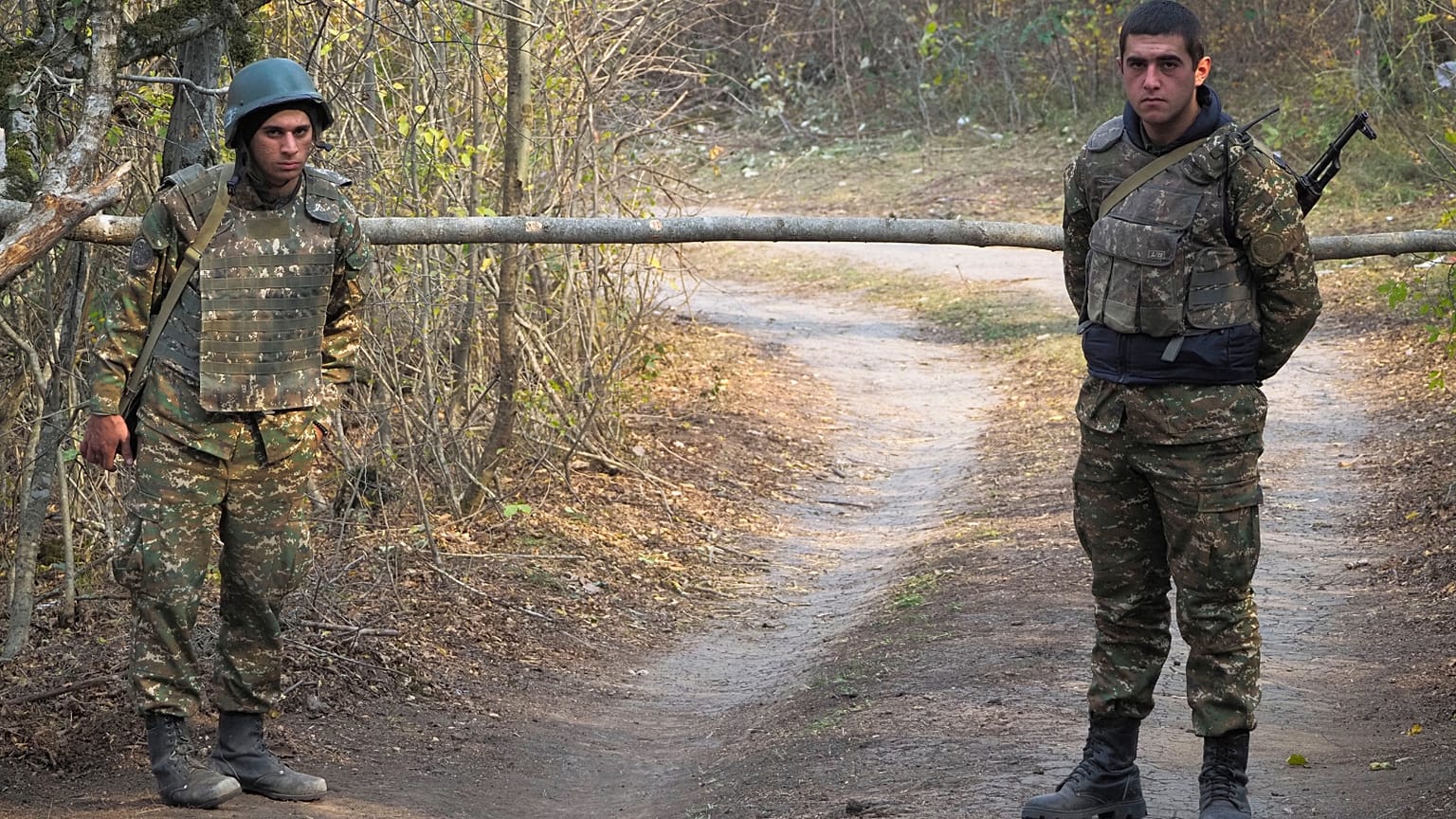 FILE: Ethnic Armenian soldiers stand at the checkpoint near the front line during a military conflict in separatist region of Nagorno-Karabakh, Monday, Nov. 2, 2020.