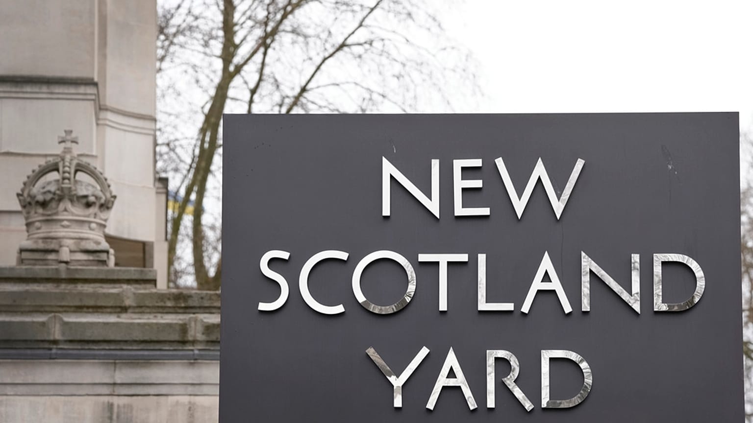 A sign outside New Scotland Yard, the headquarters of the London Metropolitan Police, in London, Tuesday, March 21, 2023. 