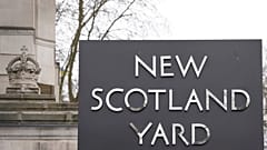 A sign outside New Scotland Yard, the headquarters of the London Metropolitan Police, in London, Tuesday, March 21, 2023. 