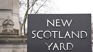 A sign outside New Scotland Yard, the headquarters of the London Metropolitan Police, in London, Tuesday, March 21, 2023.