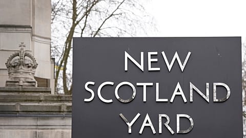 A sign outside New Scotland Yard, the headquarters of the London Metropolitan Police, in London, Tuesday, March 21, 2023. 