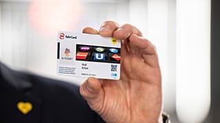Rolf Erfurt, Chief Operating Officer of Berlin's public transport company BVG, holds a 'Deutschlandticket'.