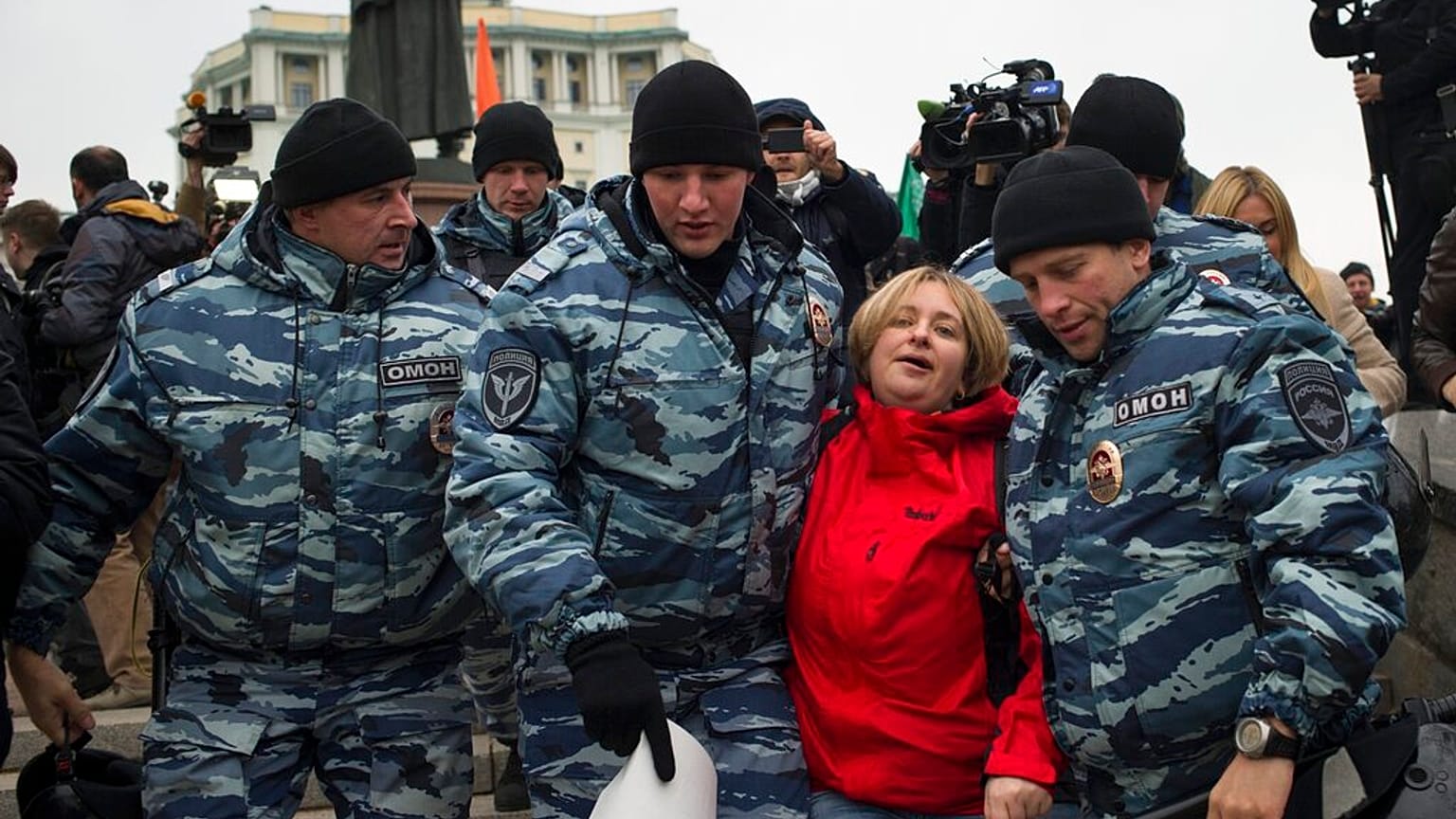 Police detain an anti-war protester in Moscow, Russia, Saturday, Oct. 17, 2015. 