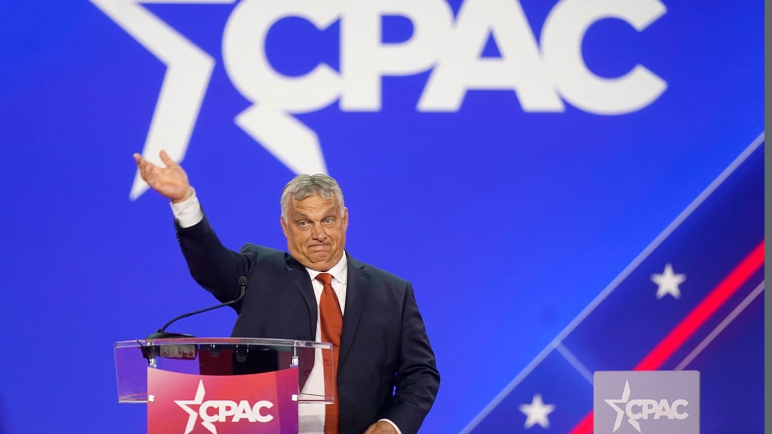 Hungarian Prime Minister Viktor Orban waves has he walks onto stage to speak at the Conservative Political Action Conference (CPAC) in Dallas. 4 August 2022