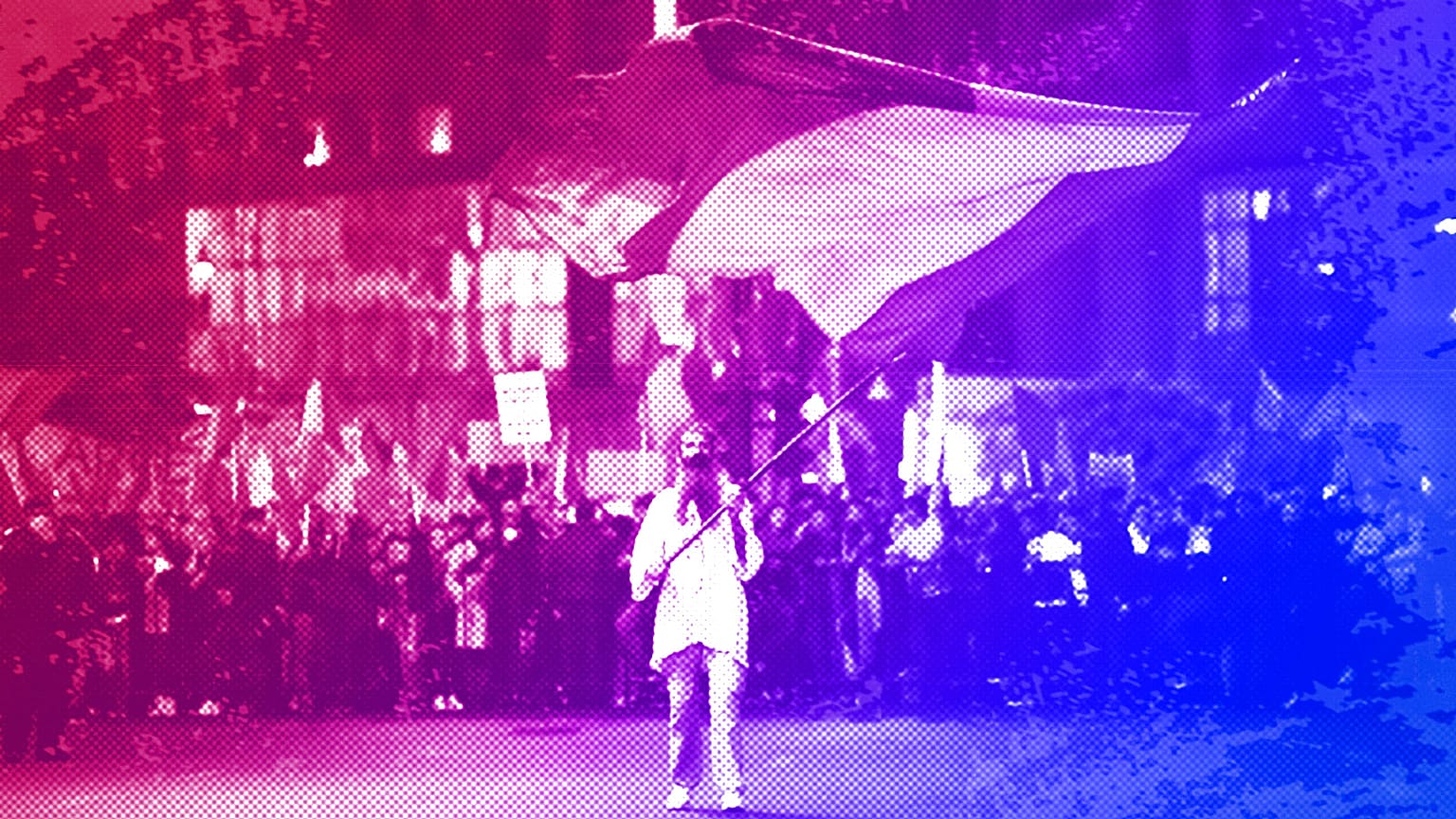 A man waves a flag outside Romania's government headquarters during an anti-government protest organised by the far-right AUR party, Bucharest, October 2021
