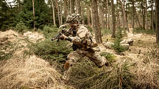 Soldiers from the Schleswig Infantry Regiment train at the Oksboel Shooting and Training Ground, Jutland, Denmark, Thursday March 16, 2023.
