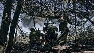 Ukrainian soldiers fire a cannon near Bakhmut, an eastern city where fierce battles against Russian forces have been taking place, in the Donetsk region, Ukraine