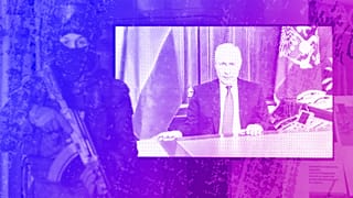 A TV screen shows Russian President Vladimir Putin announcing the beginning of the war in February 2022