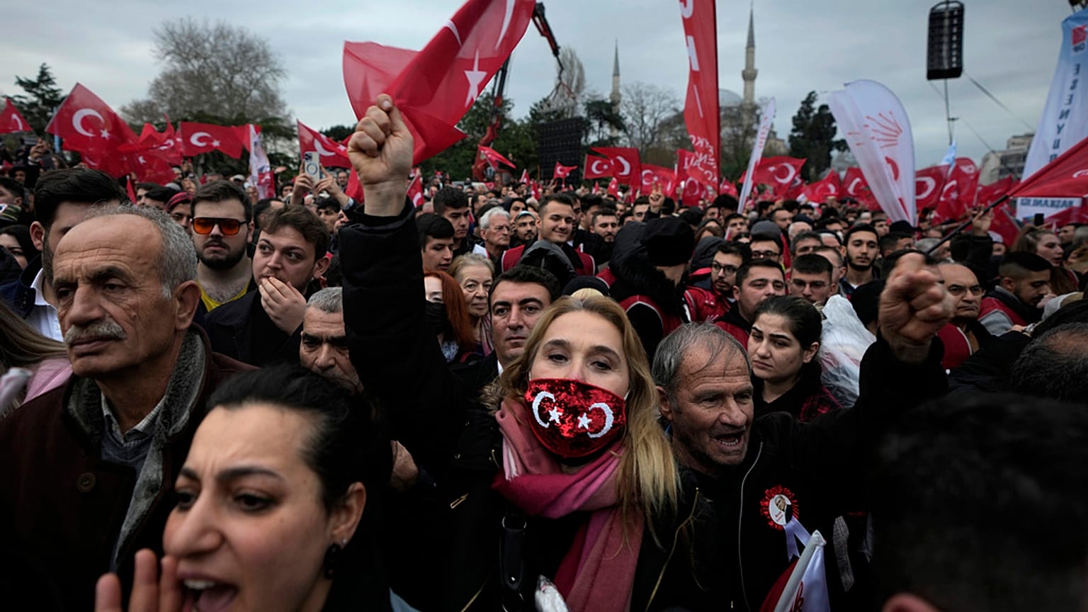 Supporters of Istanbul Mayor Ekrem Imamoglu chant slogans as they gather in front of the municipal building in Istanbul, Thursday, Dec. 15, 2022. 