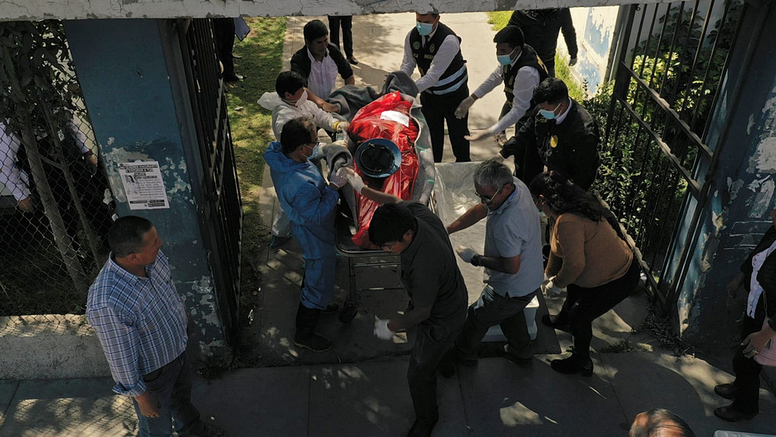 Relatives looked on as the bodies of the 27 victims were moved