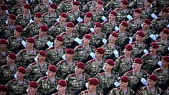 Russian soldiers march toward Red Square to attend a Victory Day military parade in Moscow, Russia, Tuesday, May 9, 2023.