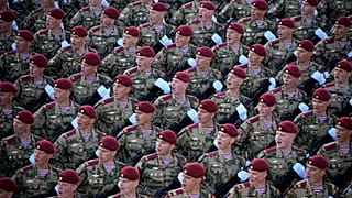 Russian soldiers march toward Red Square to attend a Victory Day military parade in Moscow, Russia, Tuesday, May 9, 2023.