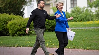 Ukrainian President Volodymyr Zelenskyy, left, and European Commission President Ursula von der Leyen approach media before their press conference in Kyiv, Ukraine.