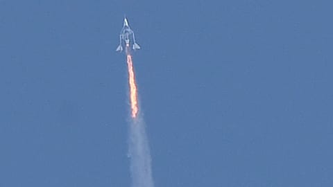 SpaceShipTwo space plane Unity and mothership separate as they fly way above Spaceport America in 2021