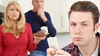 An adult living at home with their parents.