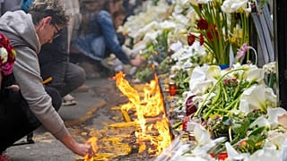 People light candles for the victims in front of the Vladimir Ribnikar school in Belgrade, Serbia. 4 May 2023