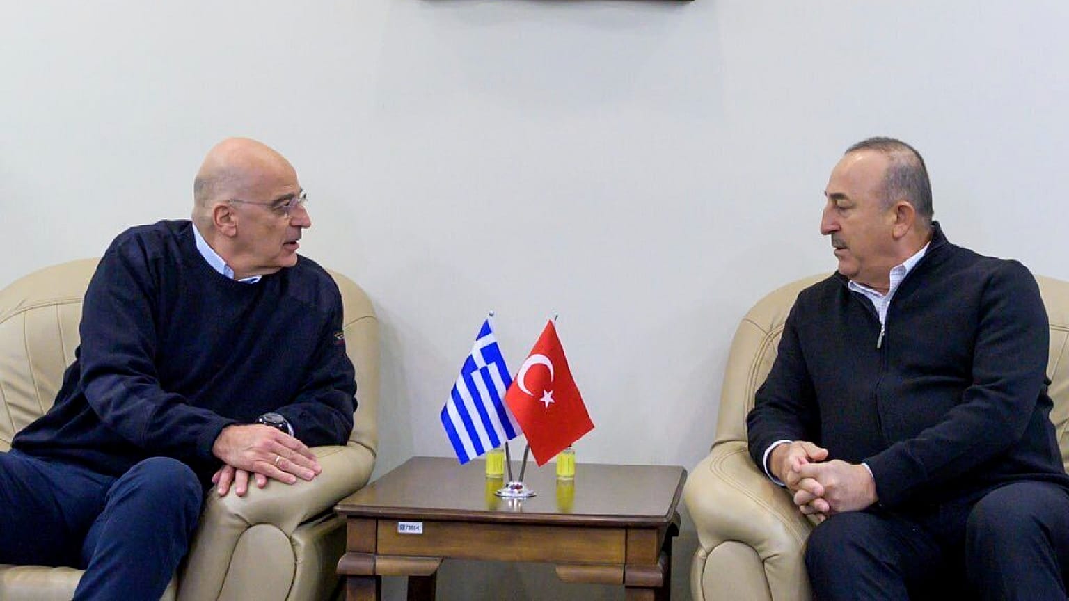  Turkey's Foreign Minister Mevlut Cavusoglu, right, talks with his Greek counterpart Nikos Dendias, in Adana, Turkey, Sunday, Feb. 12, 2023.