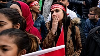 AKP supporters wait for the election results in Istanbul on May 14, 2023.