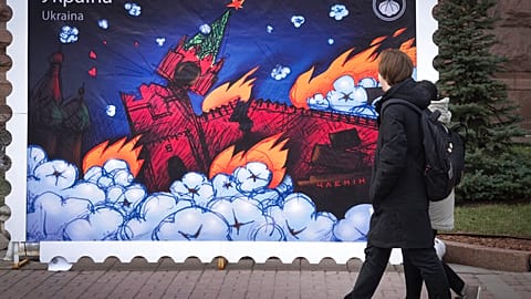Old postage stamp design depicting the burning Kremlin in Kyiv, Ukraine