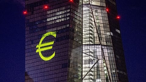 A light installation is projected onto the building of the European Central Bank during a rehearsal in Frankfurt, Germany, Dec. 30, 2021.