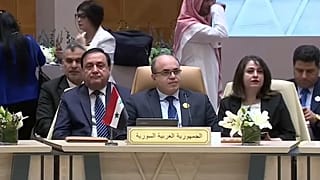 الوفد السوري خلال الاجتماع
